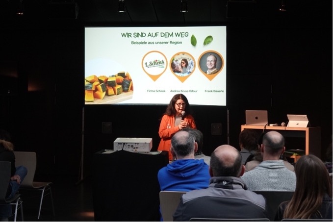 A speaker is giving a presentation