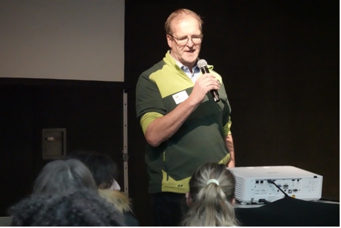 A speaker is giving a presentation