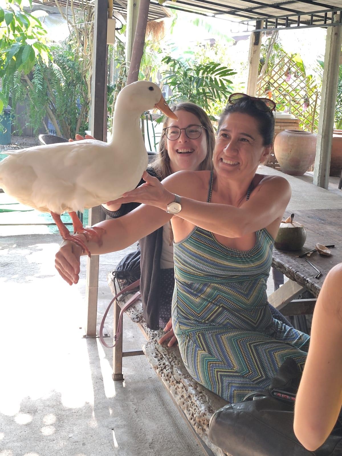 women holding a dug